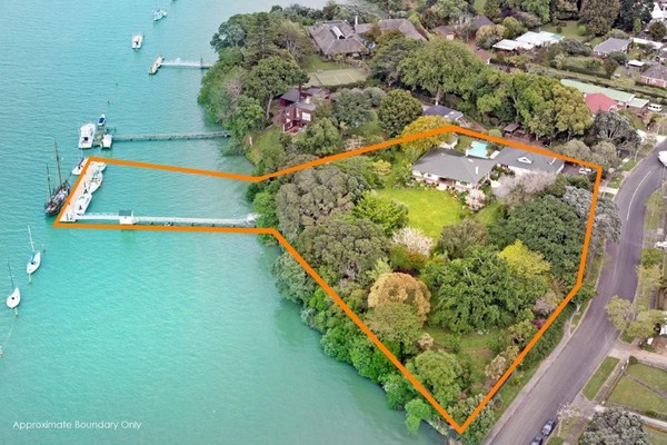 Putting a whole new angle on 'home and income' &#8211; a luxury Auckland waterfront home with a multiple mooring jetty at the bottom of the lawn. 